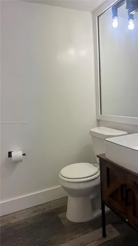 a bathroom with a toilet and a sink