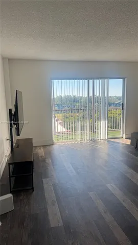 a view of livingroom with furniture and front door