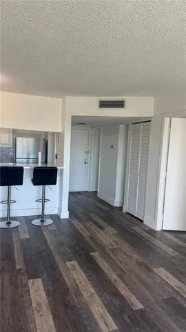 a view of a livingroom with furniture and wooden floor