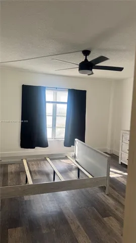 a view of an empty room with windows