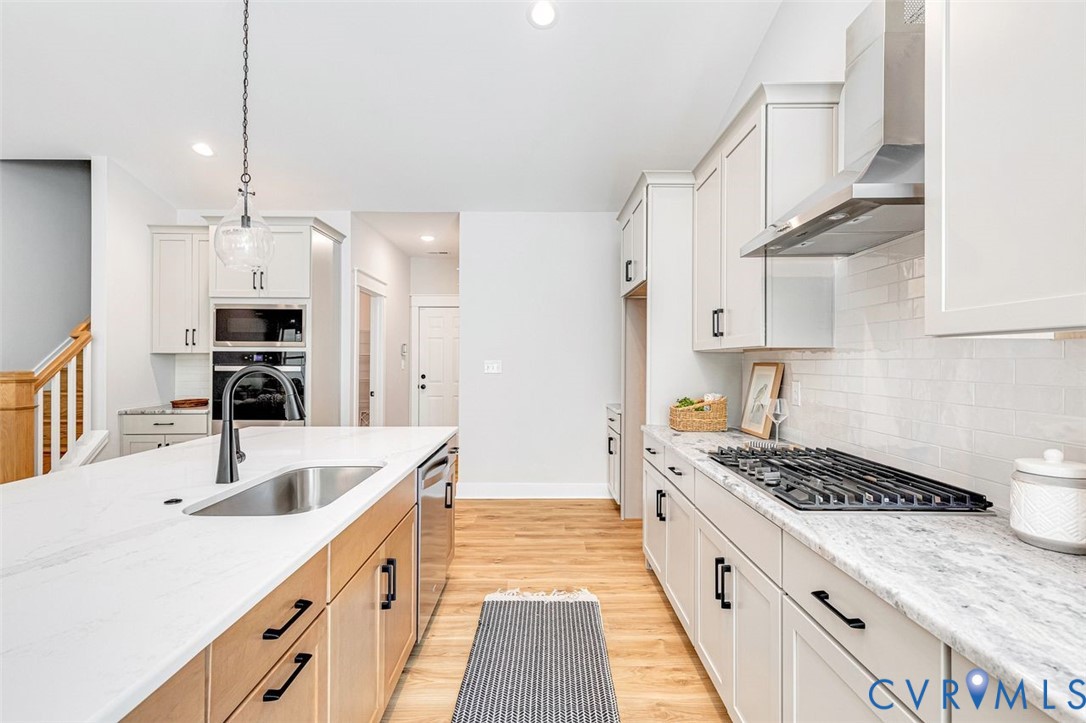 Lot 14 Red Oak Circle, Unit LOT 14 Aylett, VA 23009 - Photo 17 of 27 Kitchen featuring backsplash, wall chimney range h