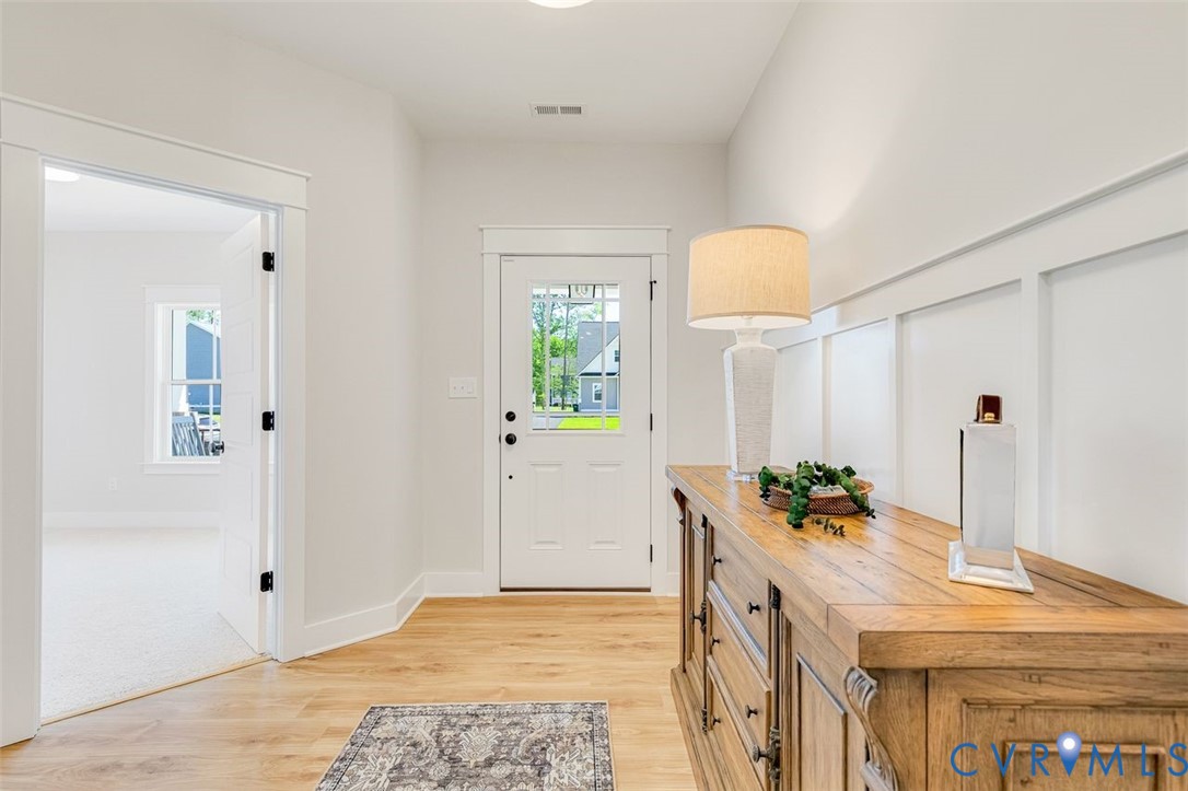 Lot 14 Red Oak Circle, Unit LOT 14 Aylett, VA 23009 - Photo 21 of 27 Doorway with wood finished floors and baseboards
