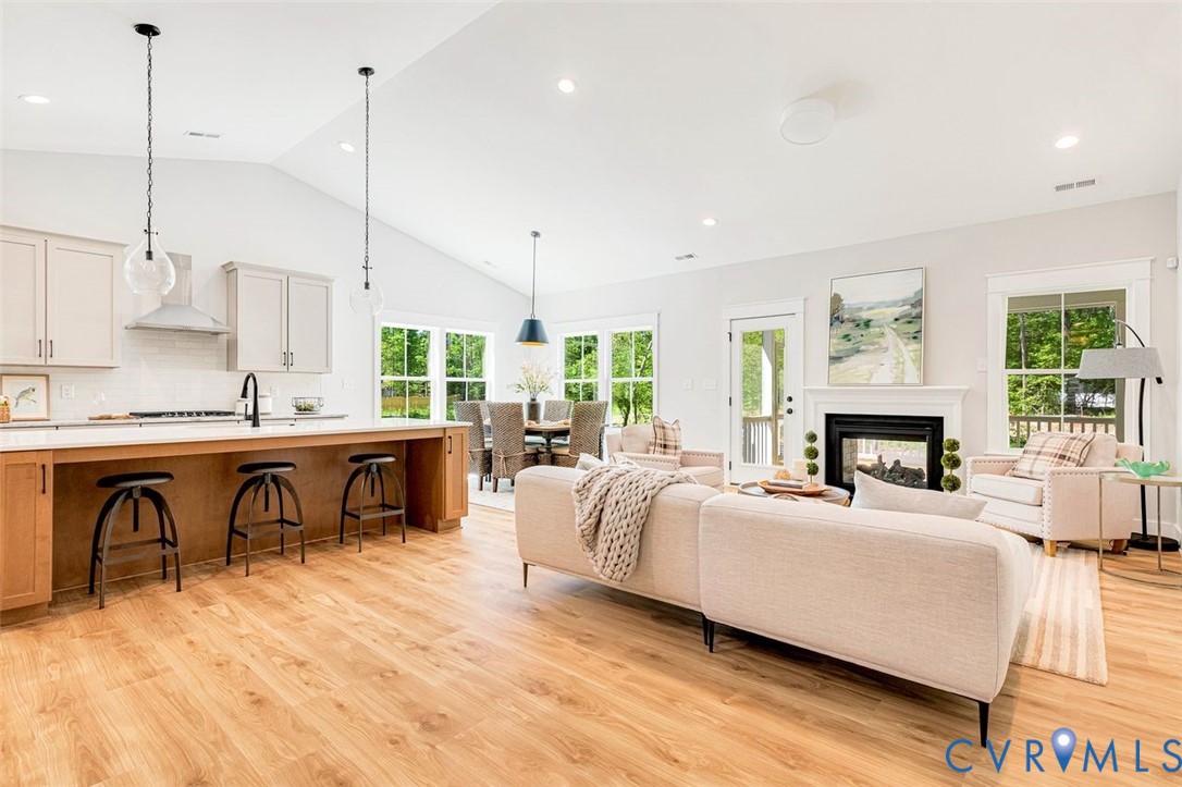 Lot 14 Red Oak Circle, Unit LOT 14 Aylett, VA 23009 - Photo 3 of 27 Living area featuring a multi sided fireplace, vau