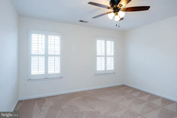 a large white bed in a white room
