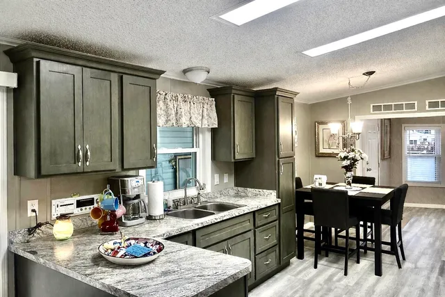 a living room with furniture a flat screen tv and a large window