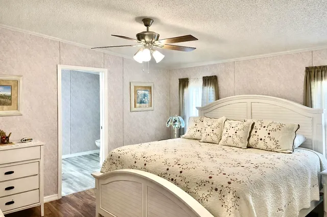 a bathroom with a sink vanity and shower