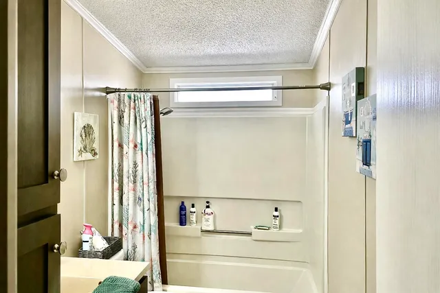 a view of a dining room with furniture large windows and wooden floor