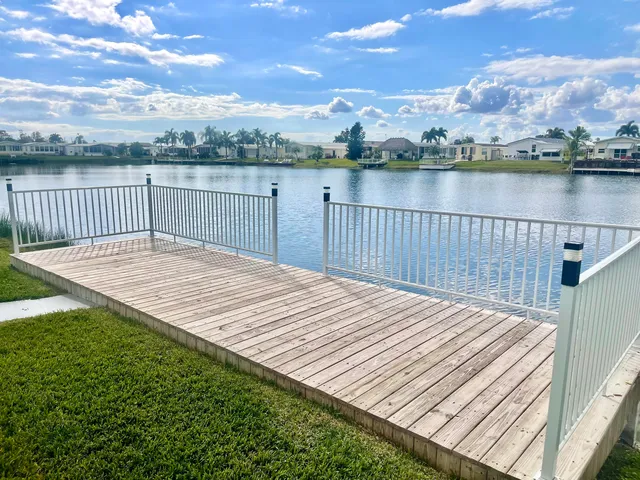 a view of a house with a yard and a garden