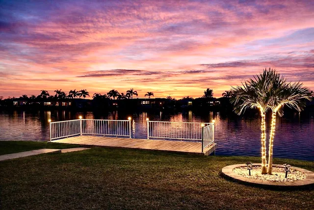 a living room filled with furniture and a large window