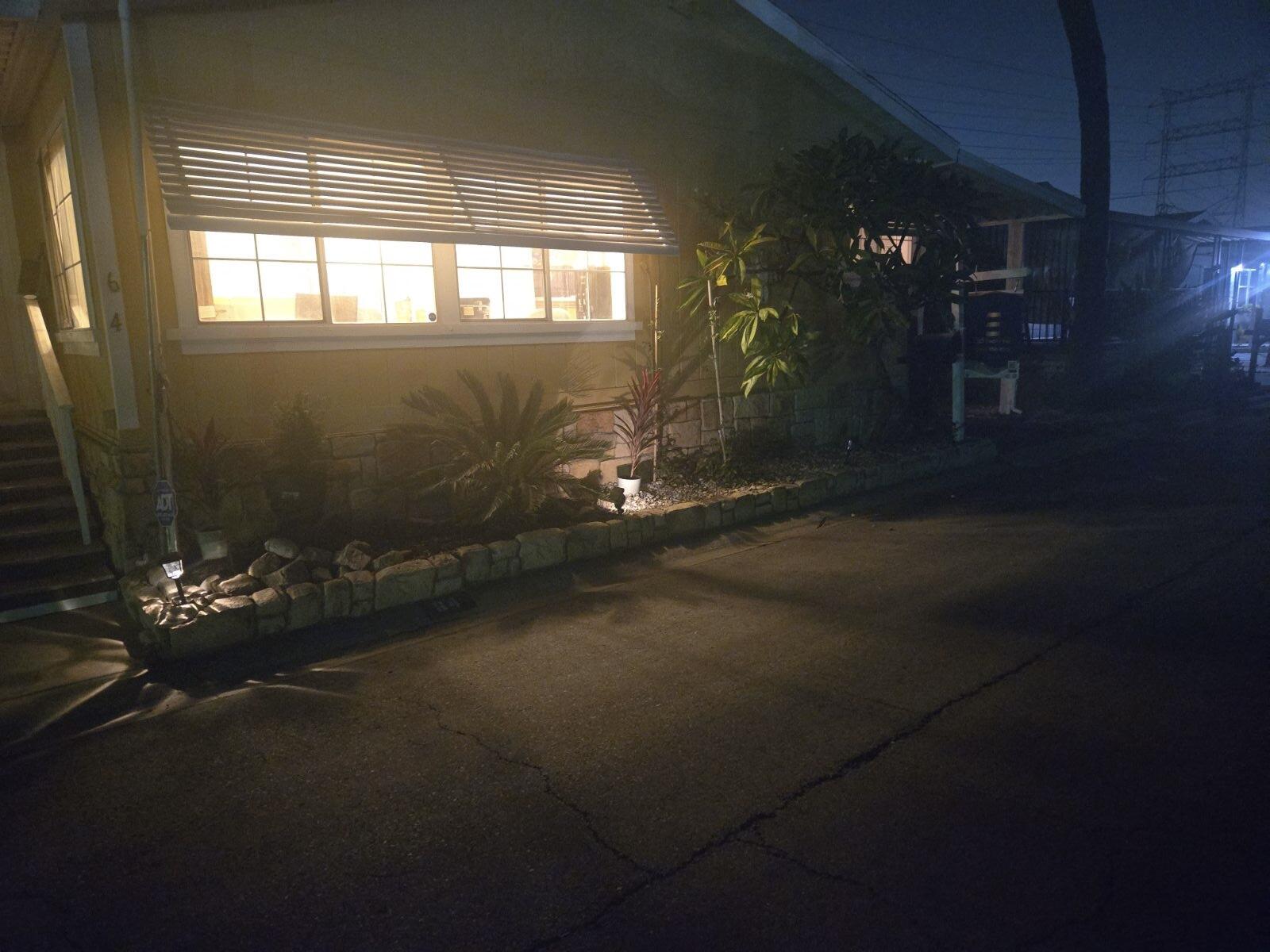 10001 West Frontage Road South Gate, CA 90280 - Photo 23 of 34 a living room with hard wood flooring and a fireplace