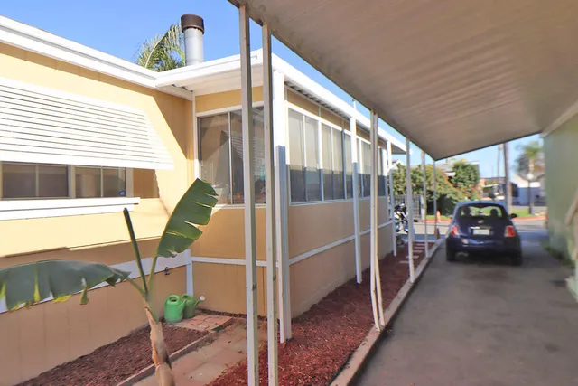 a view of a house with a tree