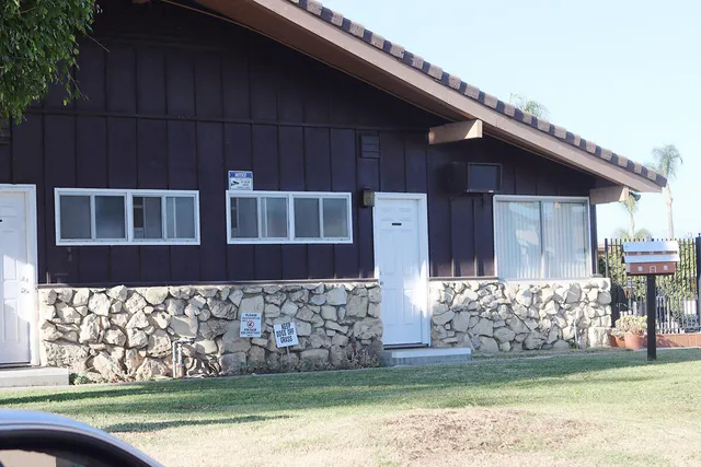 a view of a house with swimming pool and sitting area