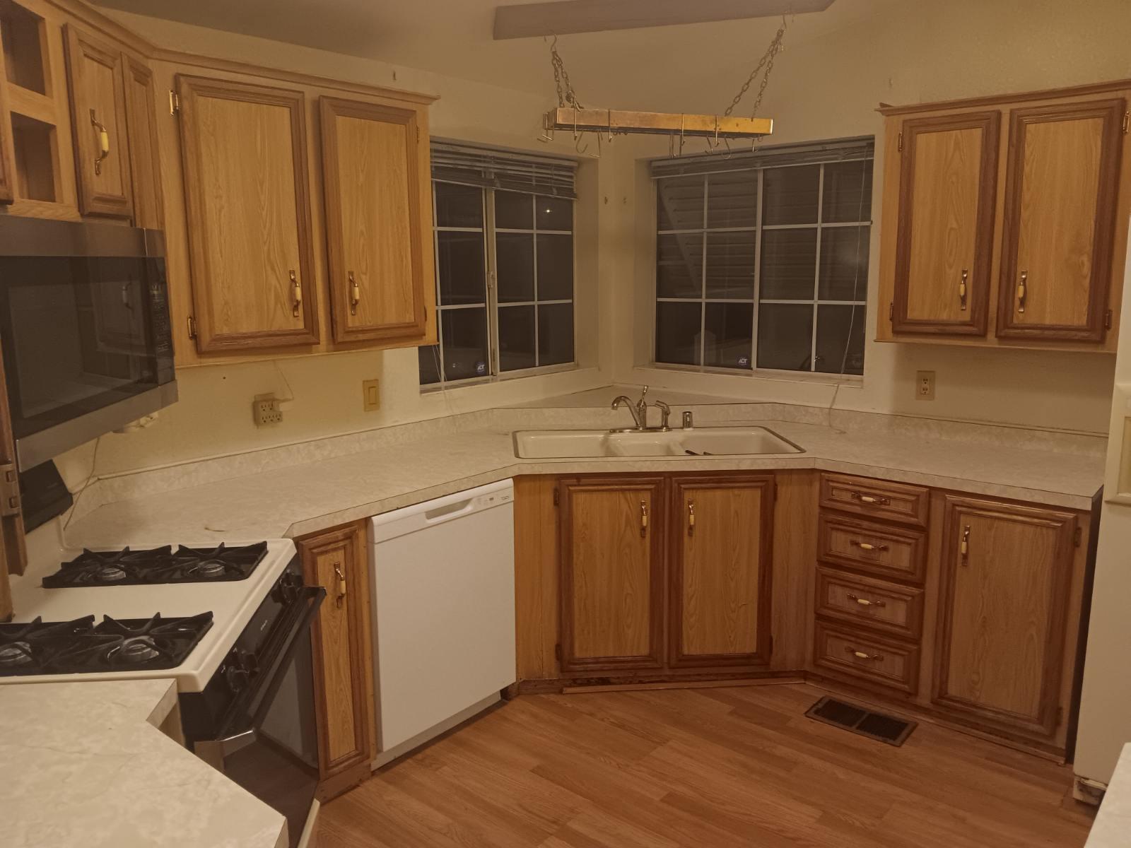 10001 West Frontage Road South Gate, CA 90280 - Photo 5 of 34 a kitchen with stainless steel appliances granite countertop a stove a sink and a microwave