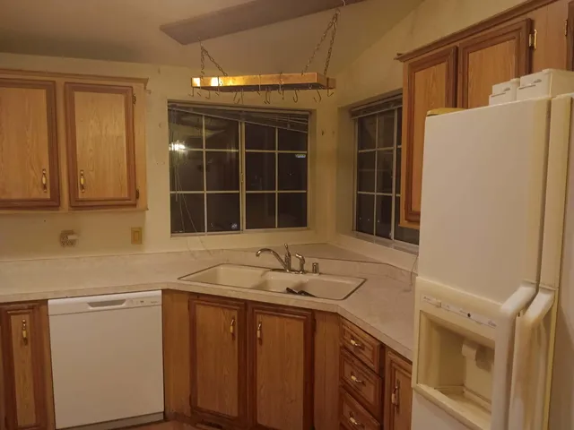 a bathroom with a sink and a window
