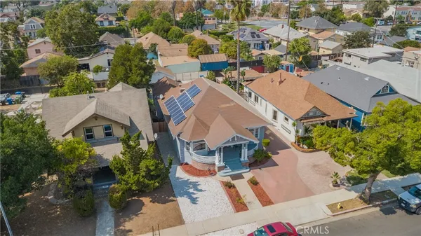 an aerial view of residential houses with outdoor space