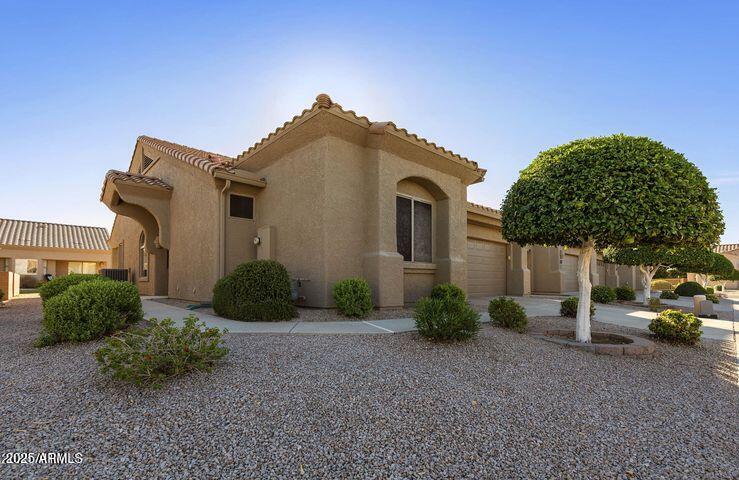 4202 East Broadway Road, Unit 223 Mesa, AZ 85206 - Photo 1 of 56 a front view of a house with garden