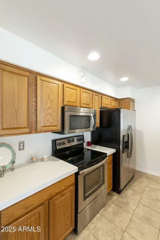 a kitchen with a stove and a microwave