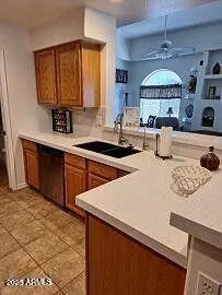 a kitchen that has a sink and a stove top oven