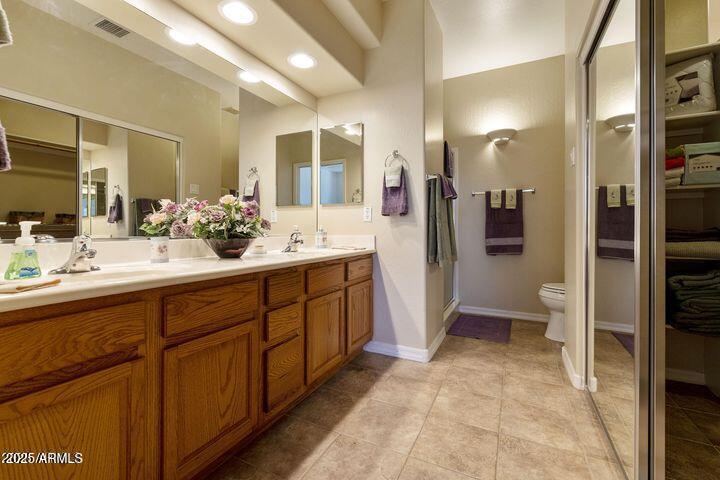 4202 East Broadway Road, Unit 223 Mesa, AZ 85206 - Photo 17 of 56 a spacious bathroom with a sink a toilet a mirror and shower