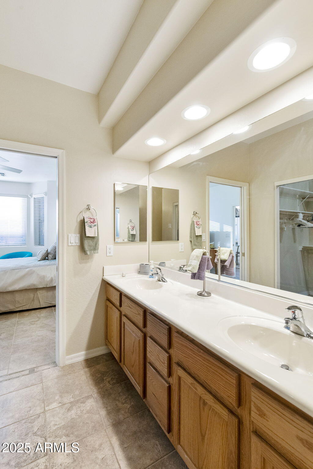 4202 East Broadway Road, Unit 223 Mesa, AZ 85206 - Photo 19 of 56 a spacious bathroom with a double vanity sink and a mirror