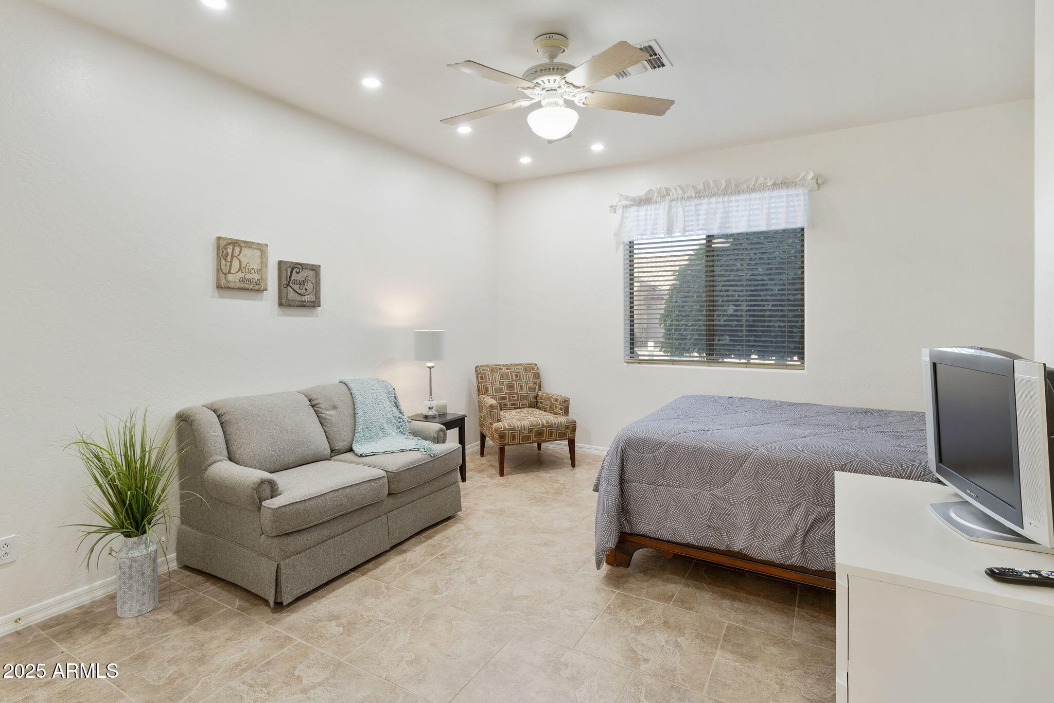 4202 East Broadway Road, Unit 223 Mesa, AZ 85206 - Photo 24 of 56 a living room with furniture and a flat screen tv