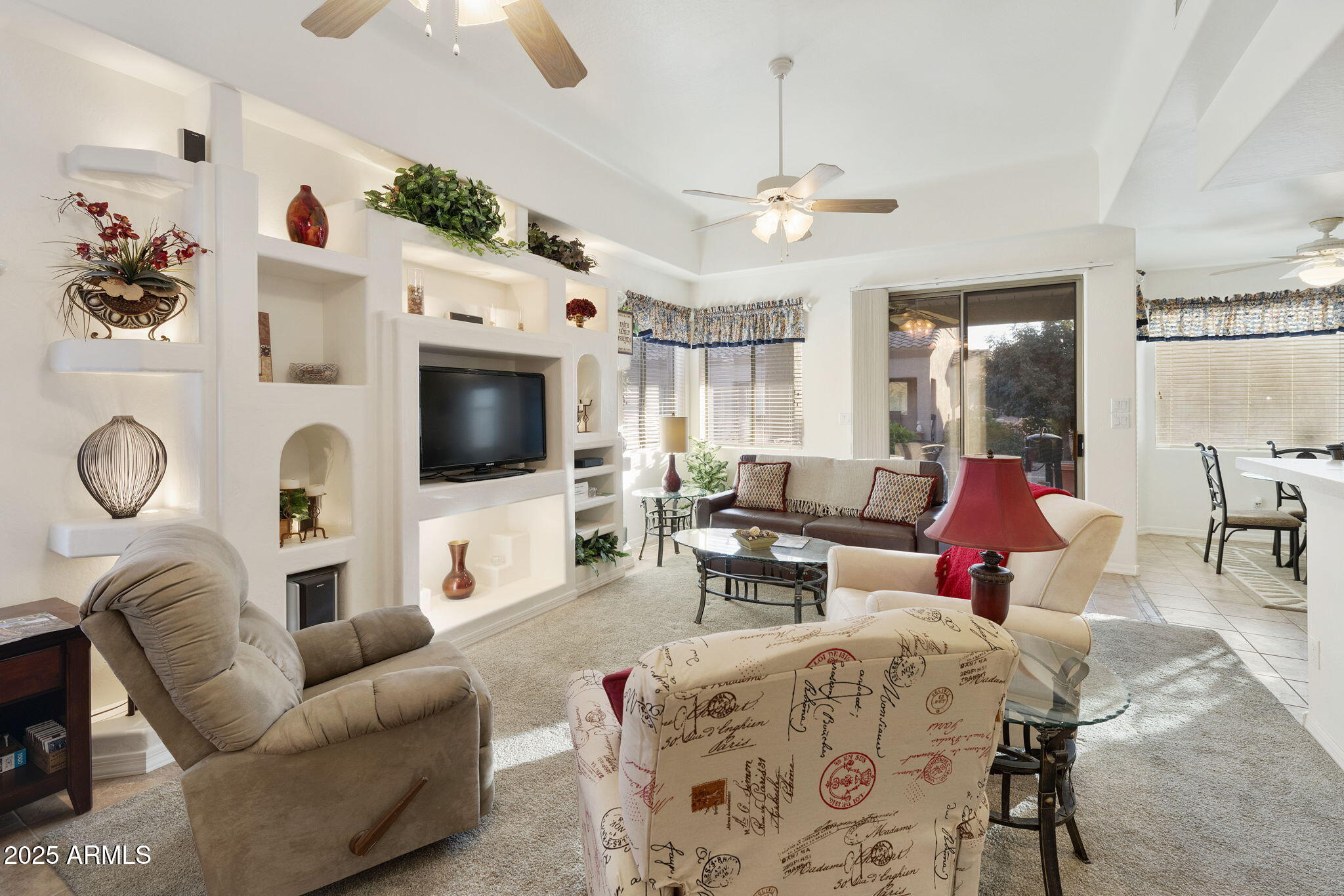 4202 East Broadway Road, Unit 223 Mesa, AZ 85206 - Photo 3 of 56 a living room with furniture and a flat screen tv