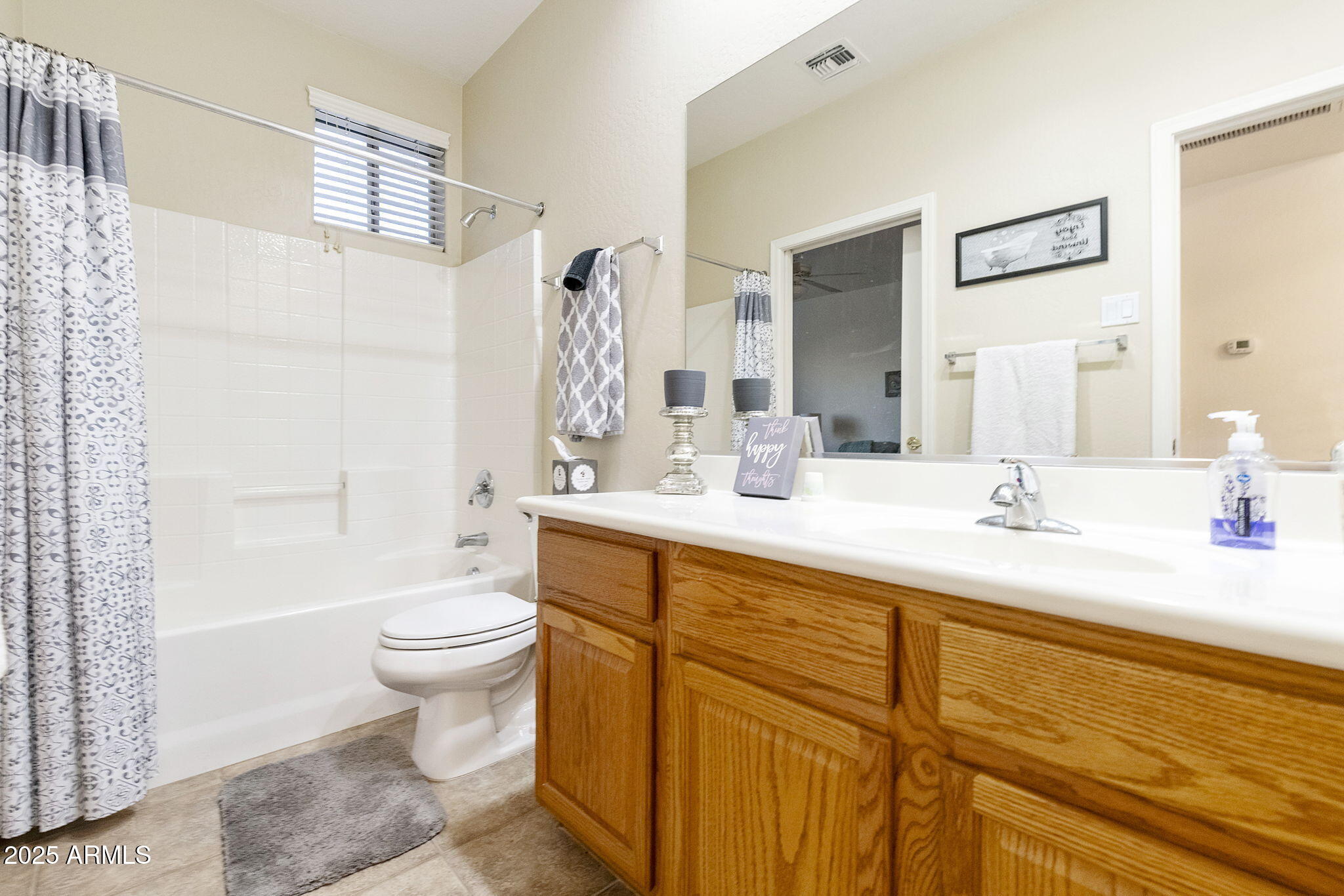 4202 East Broadway Road, Unit 223 Mesa, AZ 85206 - Photo 30 of 56 a bathroom with a sink a toilet and shower