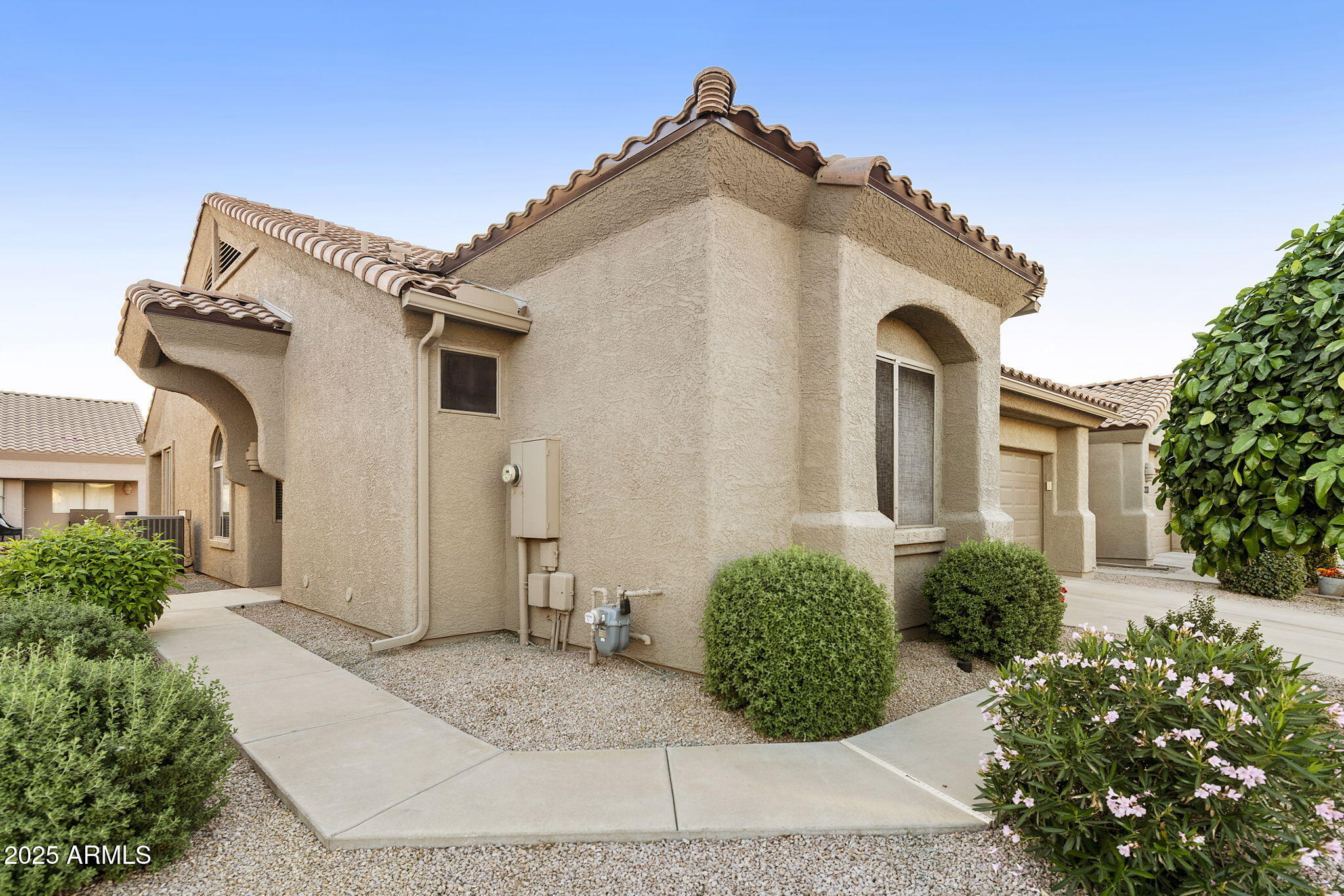 4202 East Broadway Road, Unit 223 Mesa, AZ 85206 - Photo 36 of 56 a view of a white house with a outdoor space