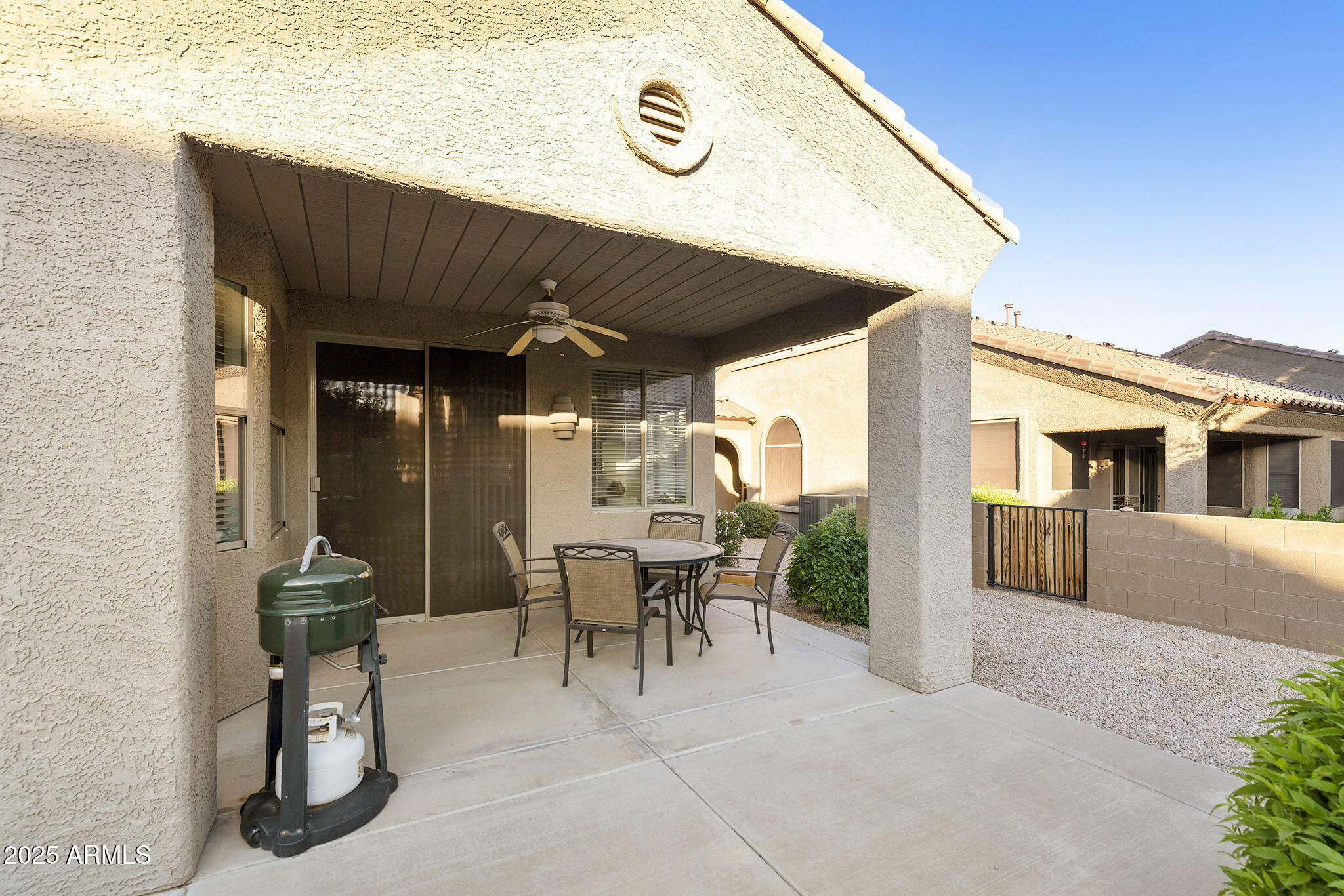 4202 East Broadway Road, Unit 223 Mesa, AZ 85206 - Photo 39 of 56 a view of a patio with table and chairs and potted plants