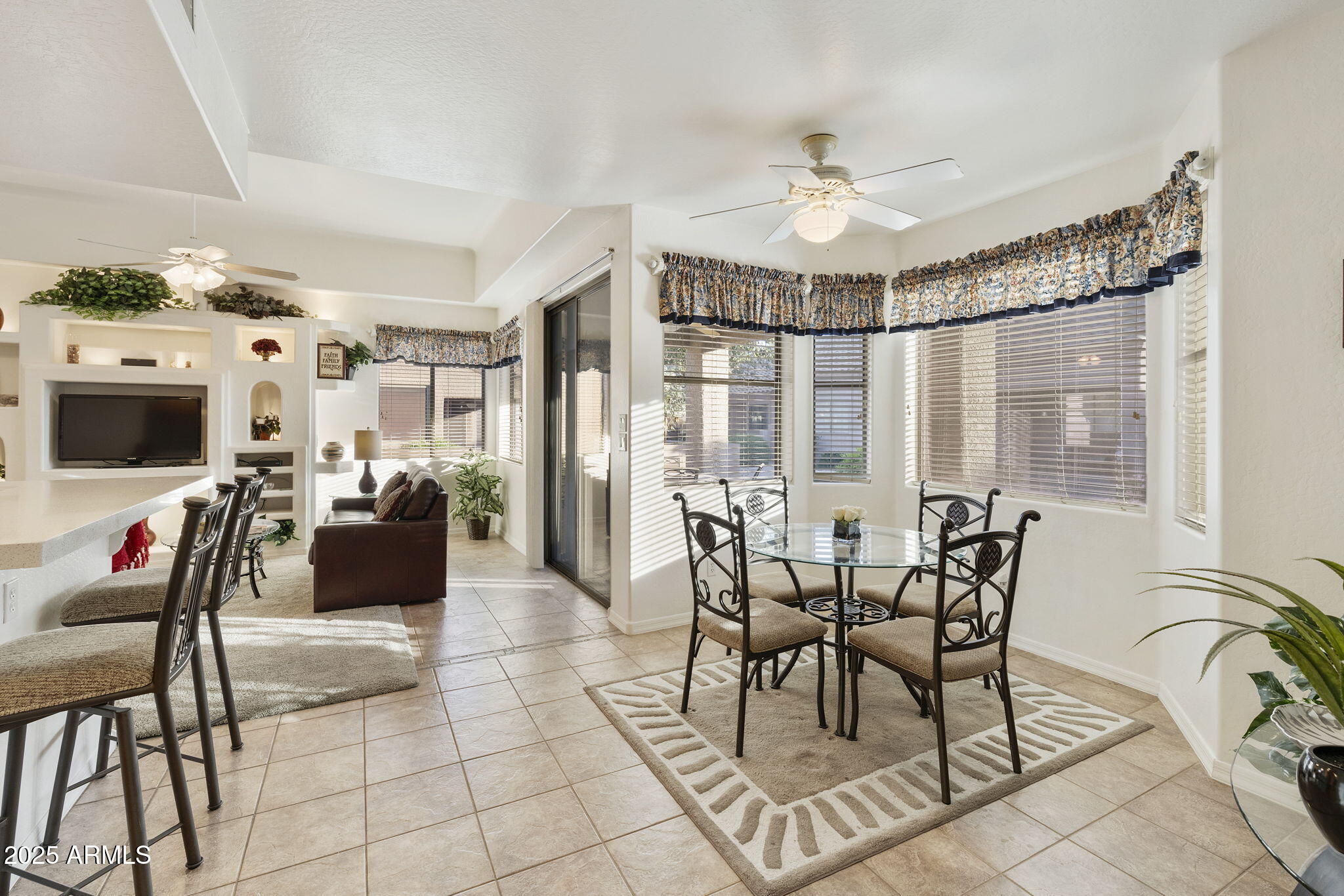 4202 East Broadway Road, Unit 223 Mesa, AZ 85206 - Photo 4 of 56 a view of a dining room with furniture window and outside view