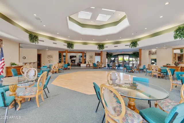 a view of a chairs and tables in the patio
