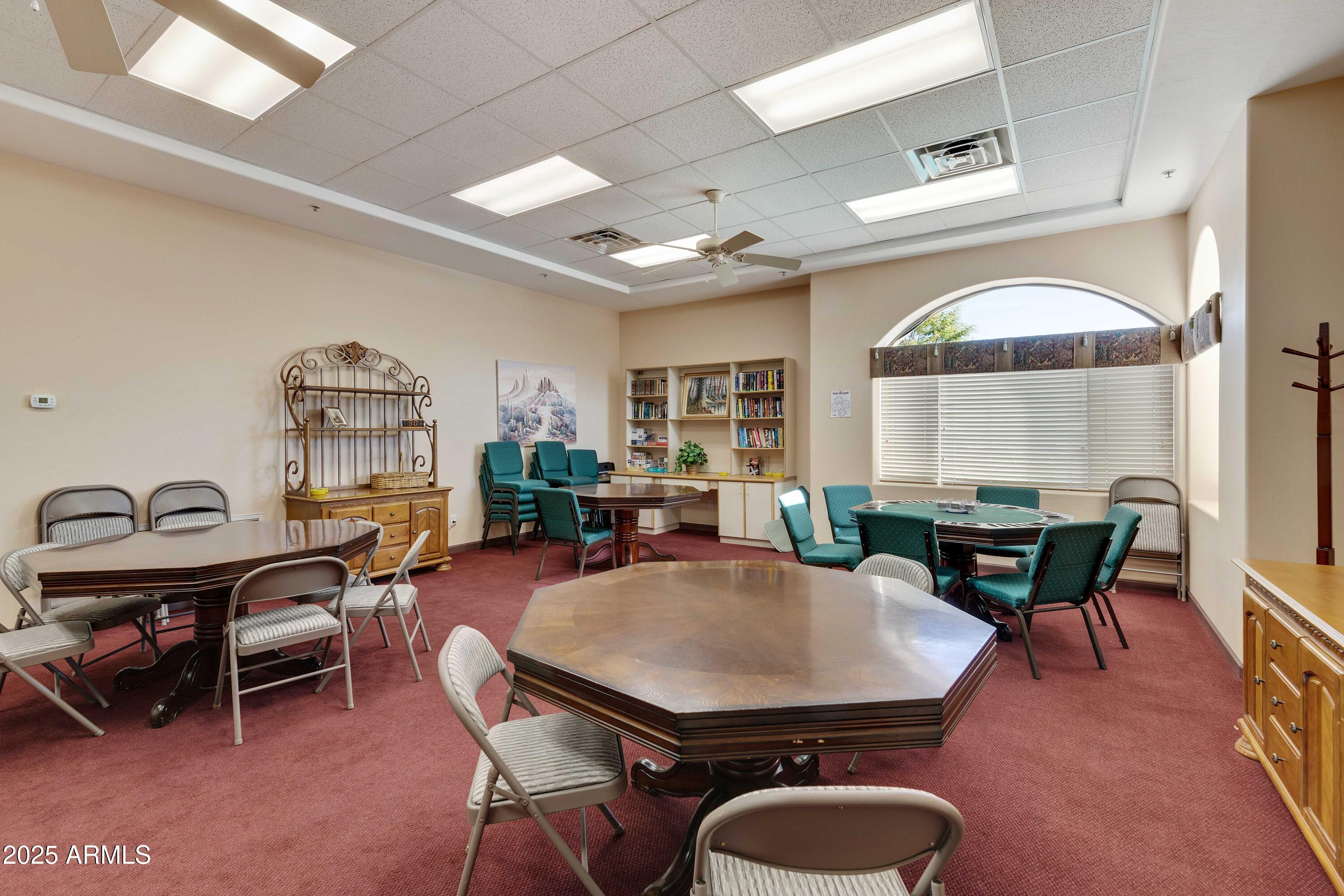 4202 East Broadway Road, Unit 223 Mesa, AZ 85206 - Photo 50 of 56 a view of a dining room with furniture window and wooden floor