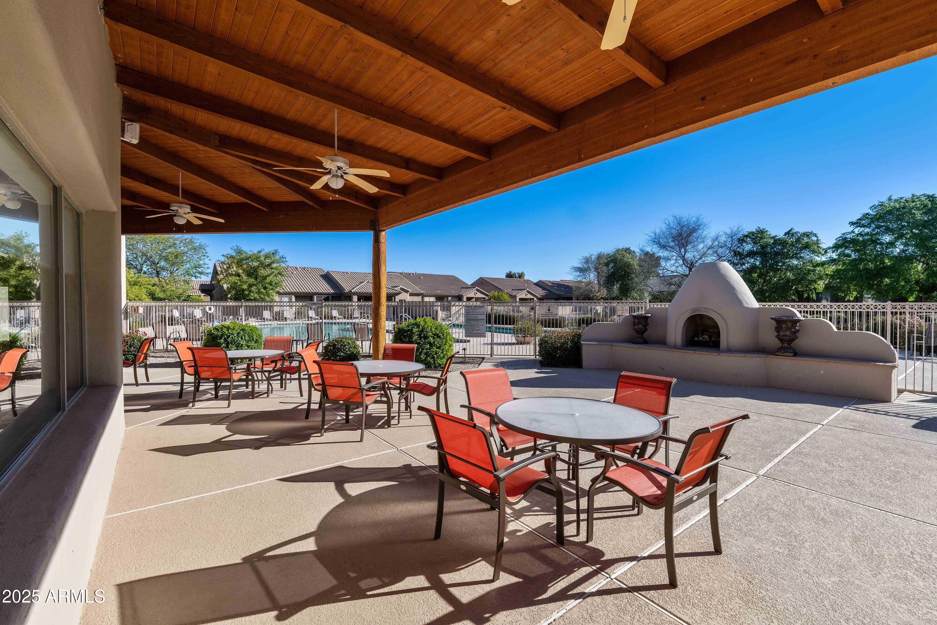 4202 East Broadway Road, Unit 223 Mesa, AZ 85206 - Photo 52 of 56 a outdoor space with patio a table and chairs