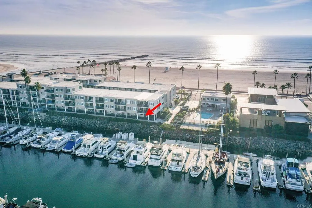 1202 North Pacific Street, Unit 101B Oceanside, CA 92054 - Photo 1 of 48 a view of ocean with boats and palm trees