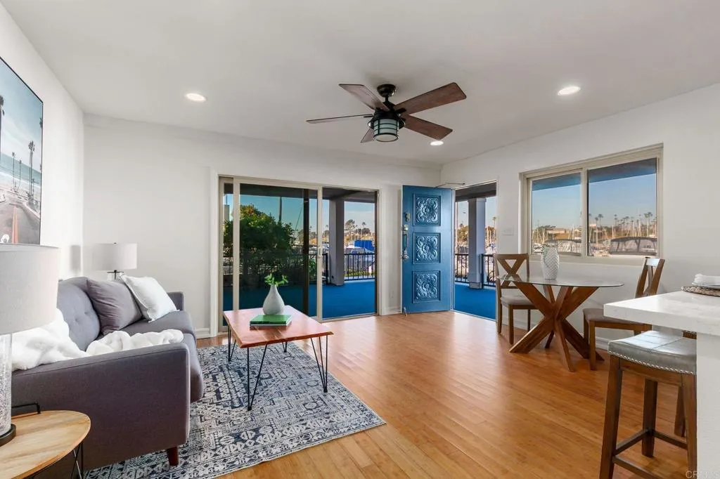 1202 North Pacific Street, Unit 101B Oceanside, CA 92054 - Photo 16 of 48 a living room with furniture dining table and a large window