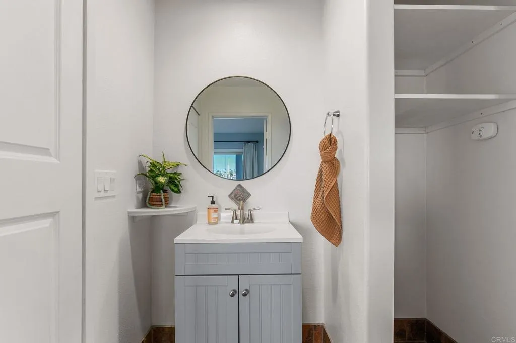 1202 North Pacific Street, Unit 101B Oceanside, CA 92054 - Photo 23 of 48 a bathroom with a sink and a mirror