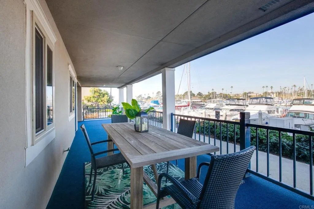 1202 North Pacific Street, Unit 101B Oceanside, CA 92054 - Photo 3 of 48 a view of balcony with furniture and wooden deck