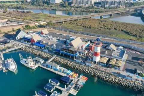 a view of a lake with a table and chairs