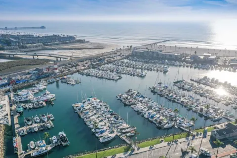 a view of a water with a table chairs and entryway