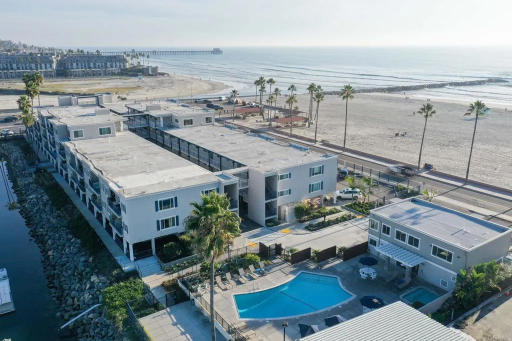 1202 North Pacific Street, Unit 101B Oceanside, CA 92054 - Photo 45 of 48 an aerial view of a house with a yard wooden floor and outdoor seating