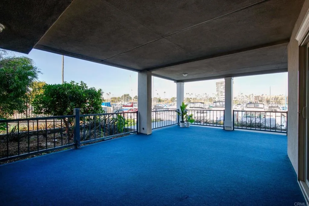 1202 North Pacific Street, Unit 101B Oceanside, CA 92054 - Photo 7 of 48 a view of a room with wooden floor and fence