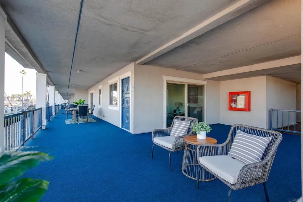 1202 North Pacific Street, Unit 101B Oceanside, CA 92054 - Photo 8 of 48 a living room with furniture and a large window