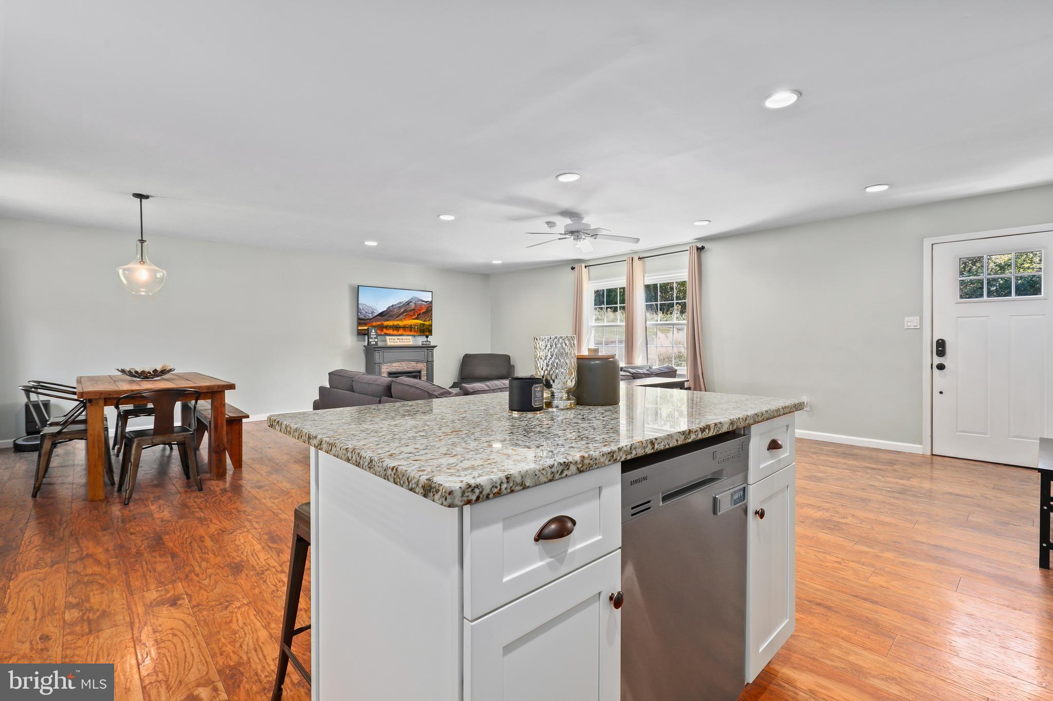9422 Brentsville Road Manassas, VA 20112 - Photo 11 of 37 a kitchen with center island table and chairs