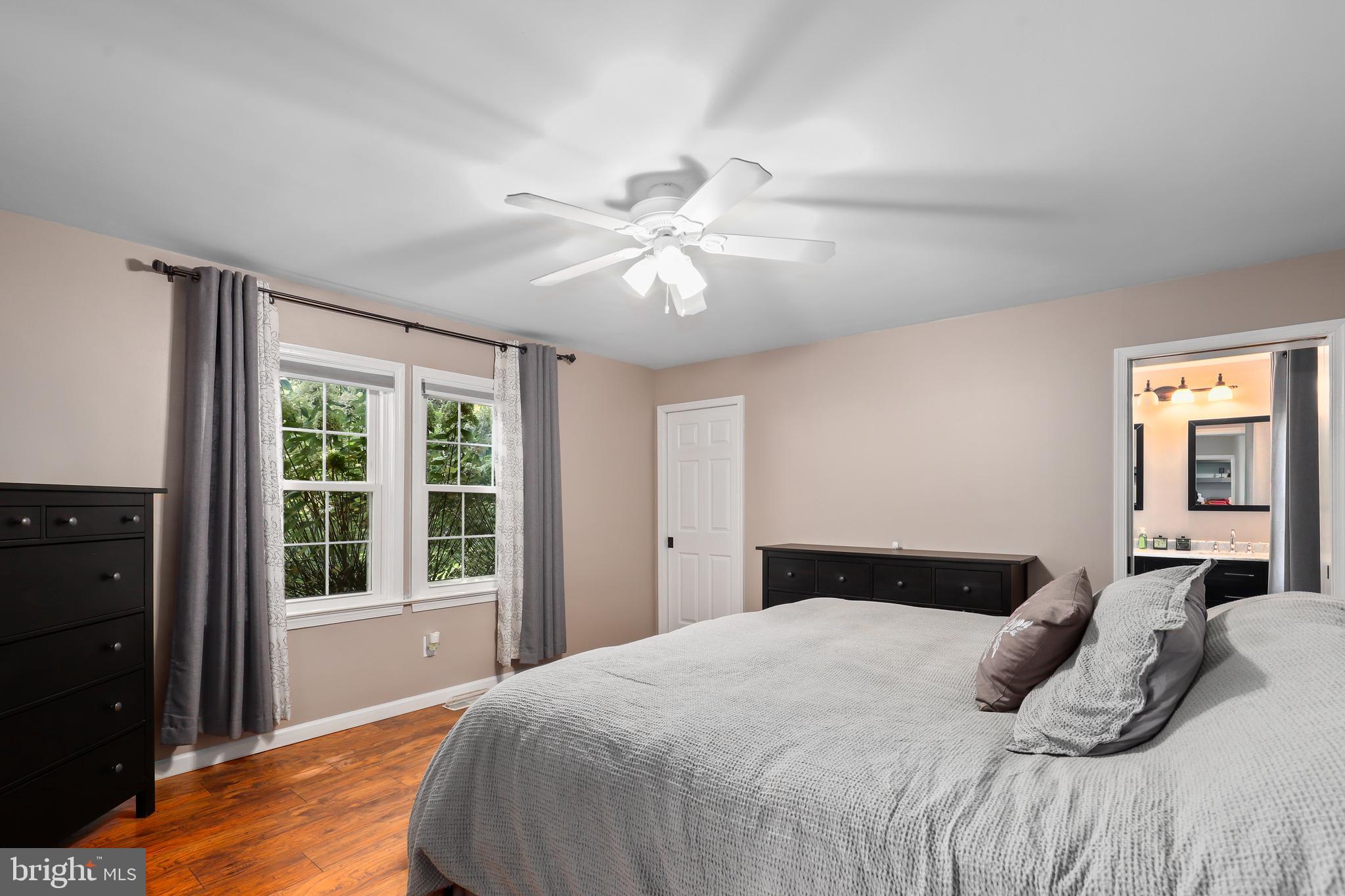 9422 Brentsville Road Manassas, VA 20112 - Photo 16 of 37 a bedroom with a large bed and a window