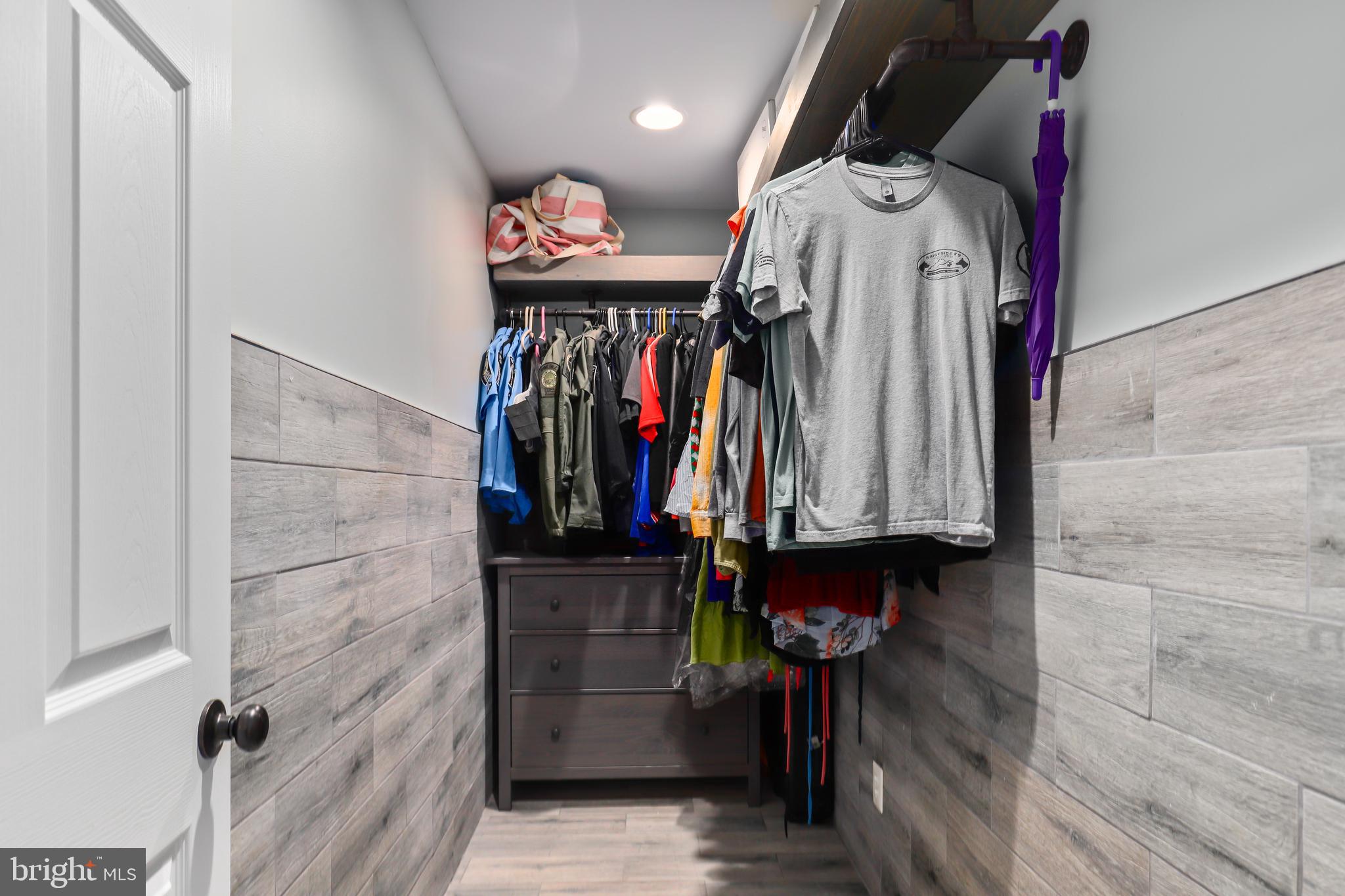 9422 Brentsville Road Manassas, VA 20112 - Photo 17 of 37 a view of walk in closet with clothes