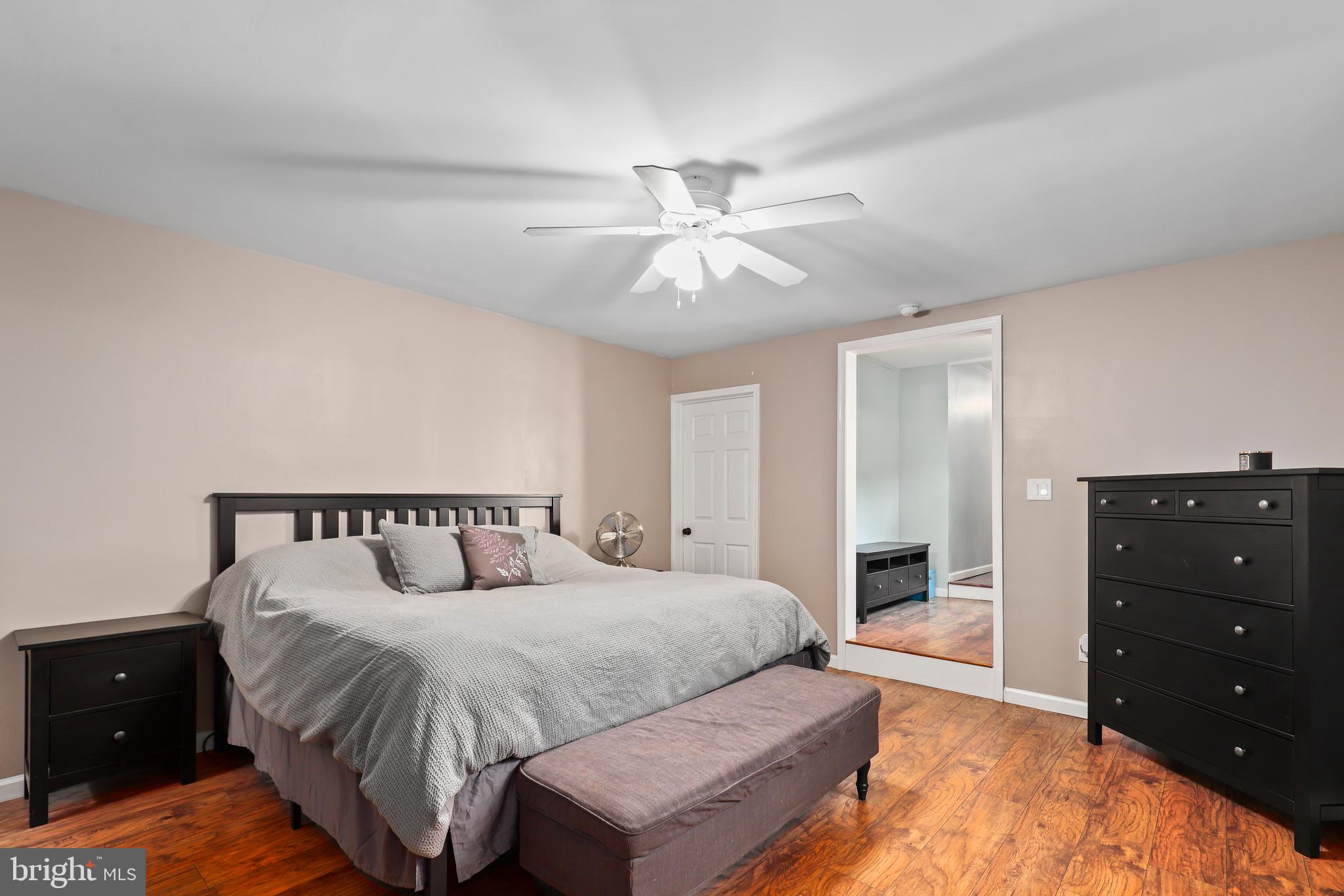 9422 Brentsville Road Manassas, VA 20112 - Photo 18 of 37 a spacious bedroom with a bed and a table