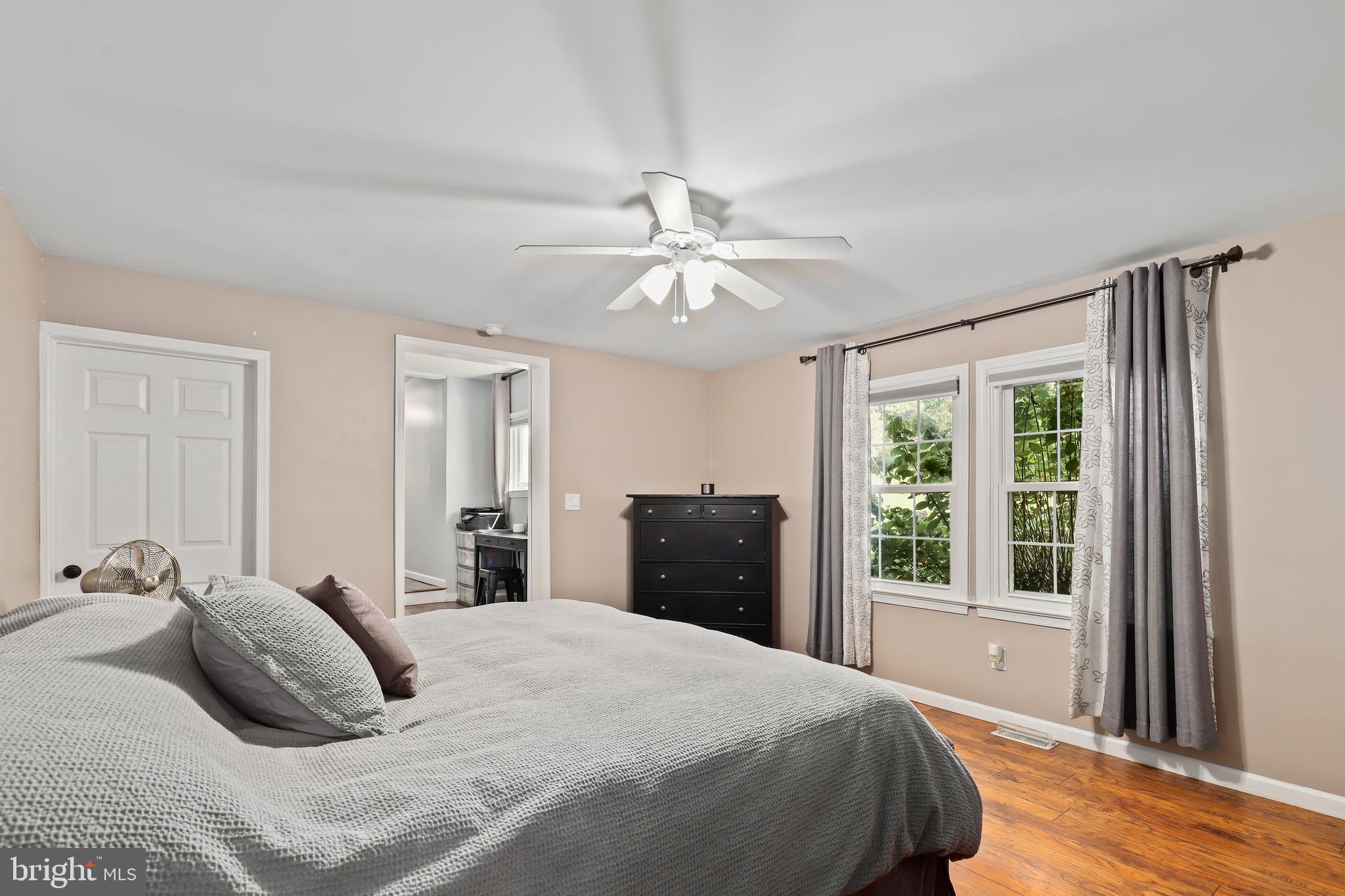 9422 Brentsville Road Manassas, VA 20112 - Photo 19 of 37 a bedroom with a large bed and a window