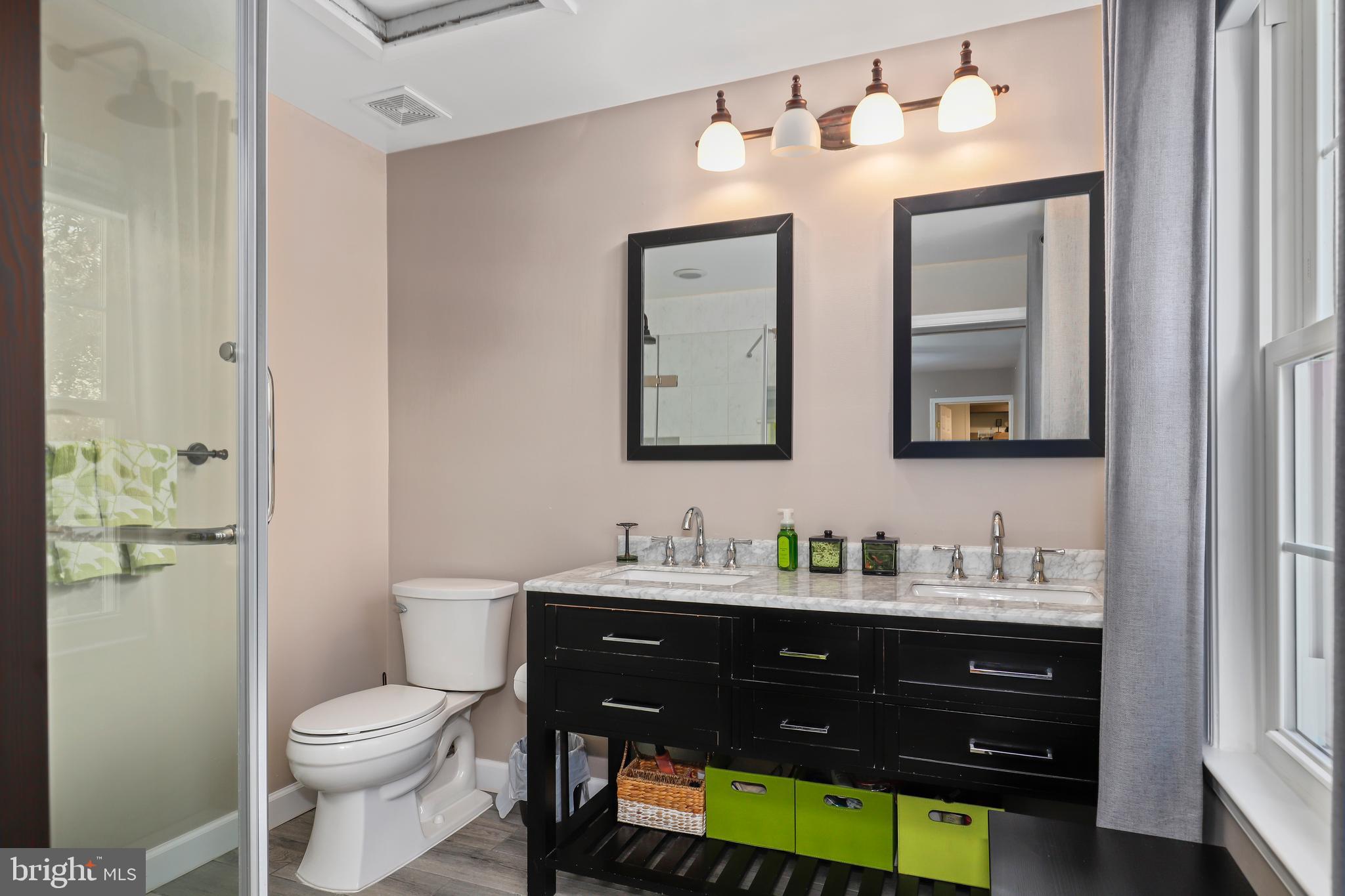 9422 Brentsville Road Manassas, VA 20112 - Photo 20 of 37 a bathroom with a toilet sink and mirror