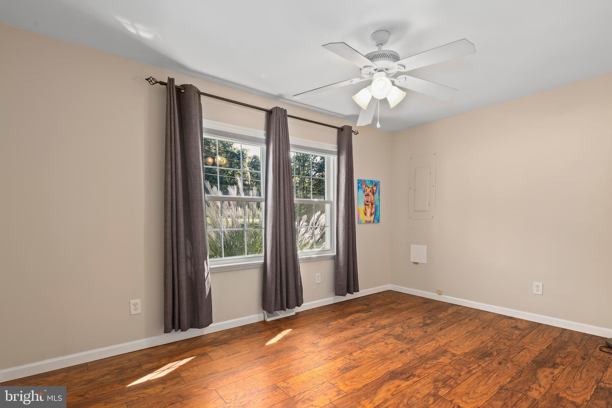 9422 Brentsville Road Manassas, VA 20112 - Photo 22 of 37 a view of a livingroom with a ceiling fan and window