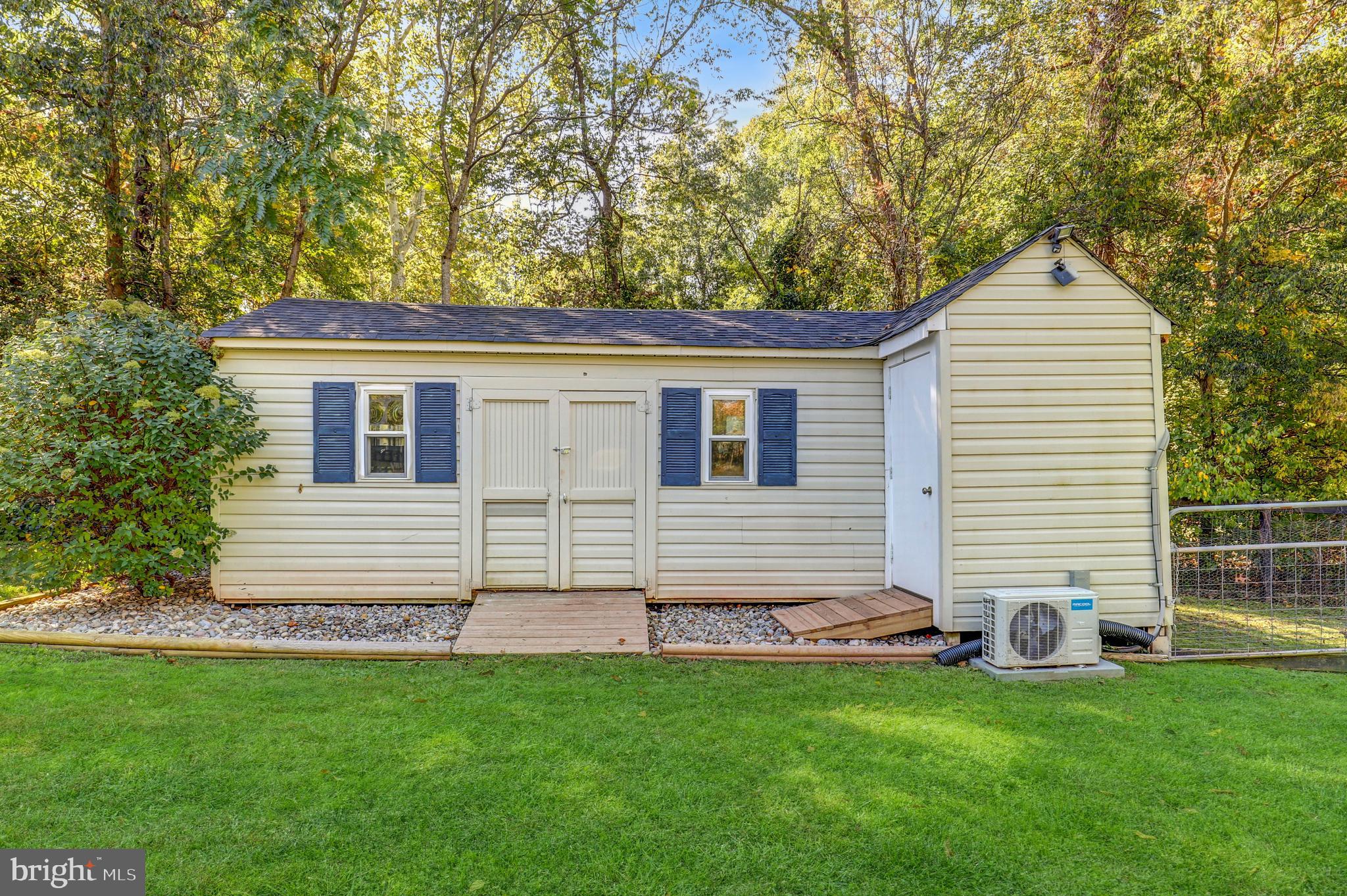 9422 Brentsville Road Manassas, VA 20112 - Photo 29 of 37 a view of a house with a backyard
